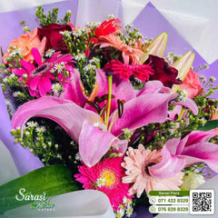 Vibrant Fuchsia Pink Lily and Rose Bouquet in Purple Wrapping